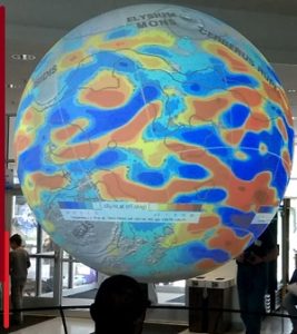 Giant sphere illustrating a heat map and other planetary-scale scientific visualizations.